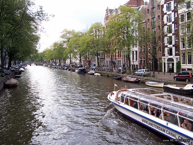 The old quarter of Amsterdam is surrounded by a magical belt of semi-circular canals.