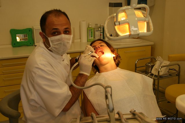 Panur, dentist and motorcyclist, alleviating Elke's pain.